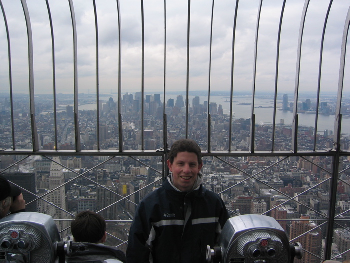 Jonathan sitting on the edge of the Empire State Building