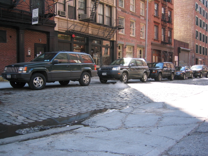 Steam rising from a New York manhole cover