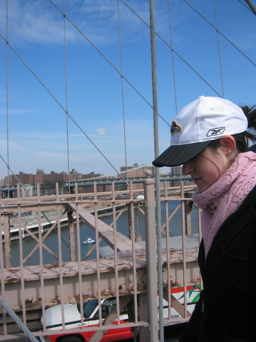 Catherine walking across the Brooklyn Bridge